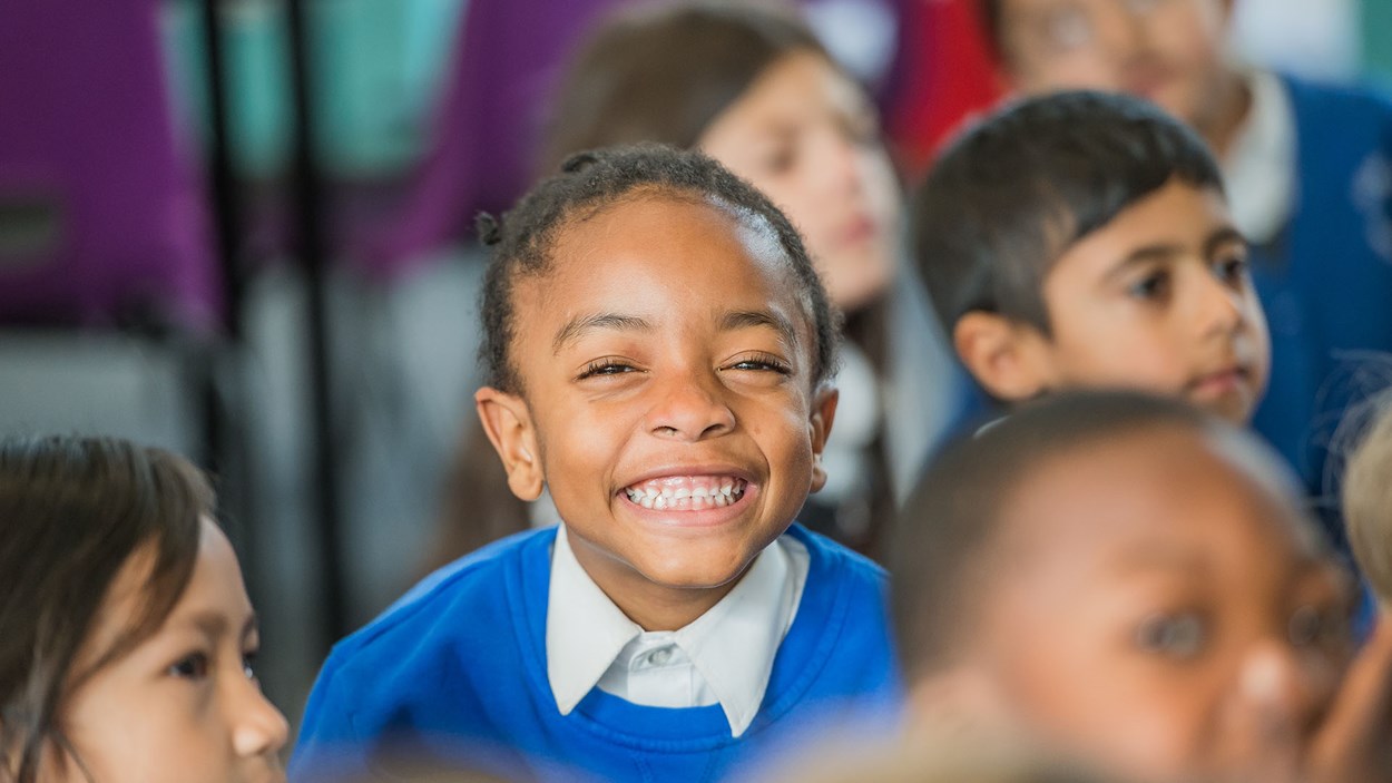 A happy pupil in class at a primary school