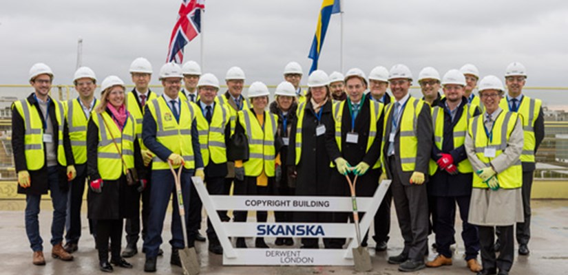 Representatives from Skanska, Derwent London and partners celebrate the topping out Representatives from Skanska, Derwent London and partners celebrate the topping out