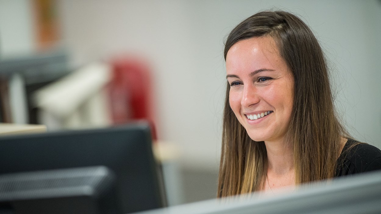 A happy woman in an office