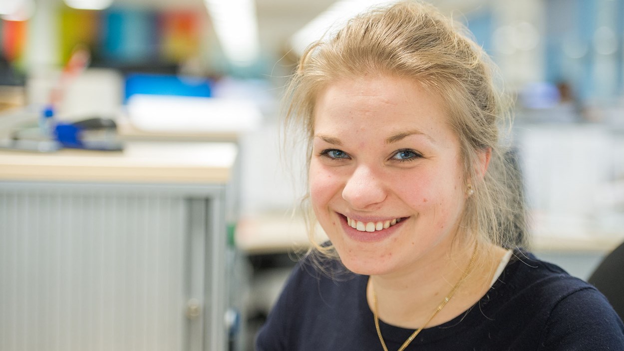 A smiling woman in an office