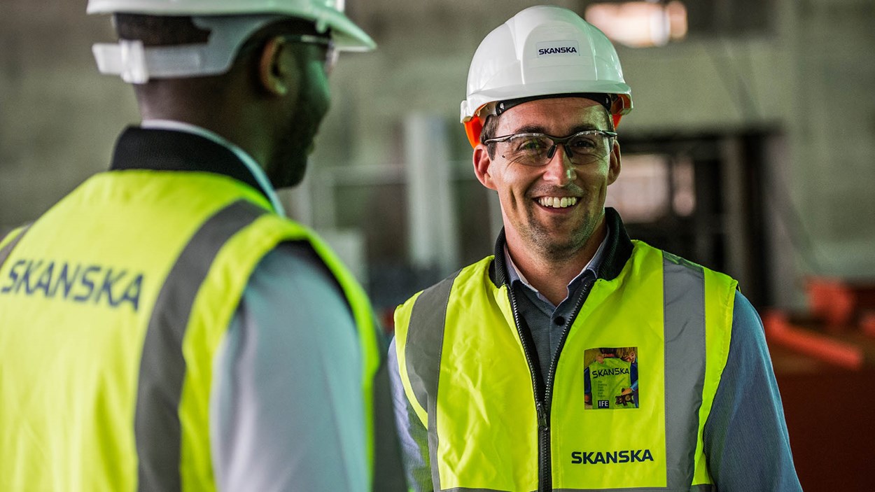 Two people from Skanska on site at a project
