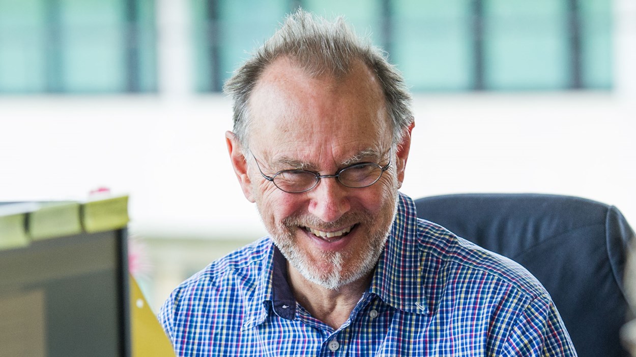 A happy smiling man in an office