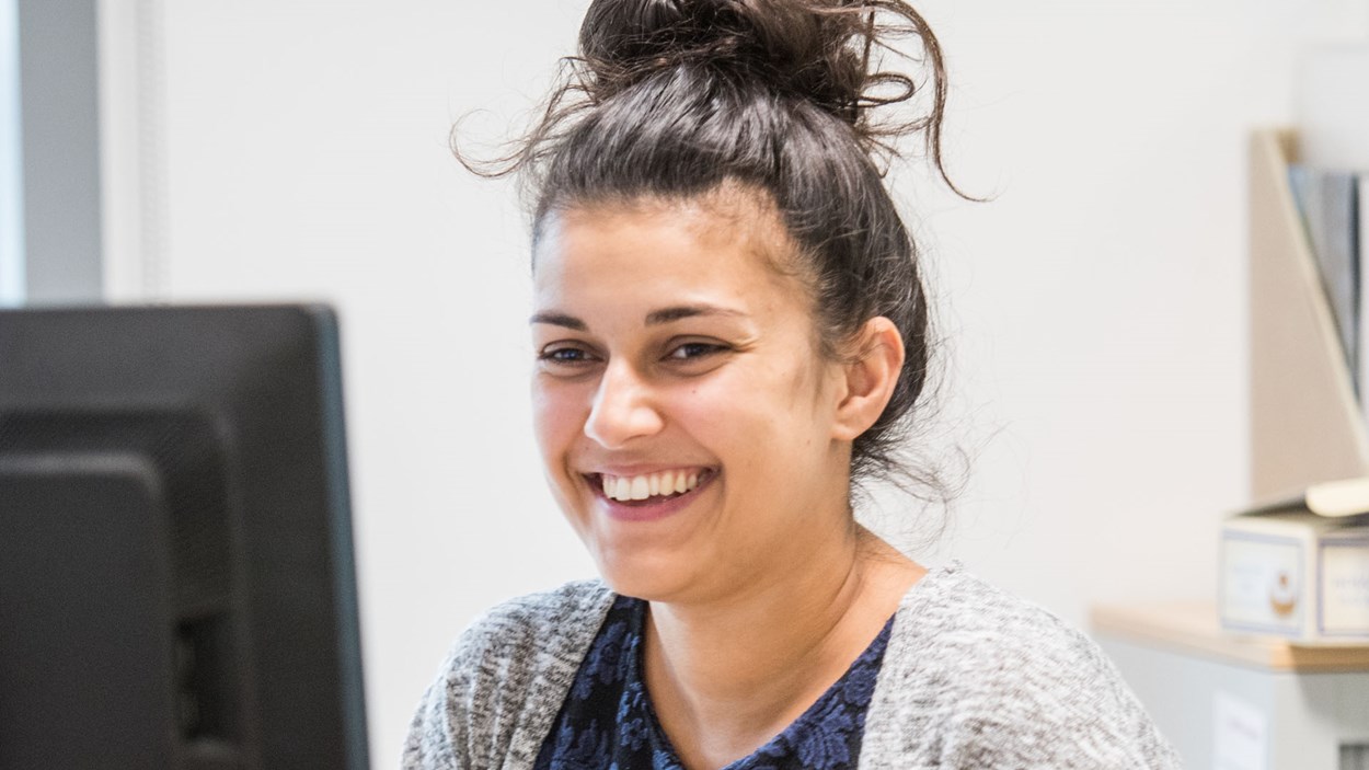 A smiling woman in an office