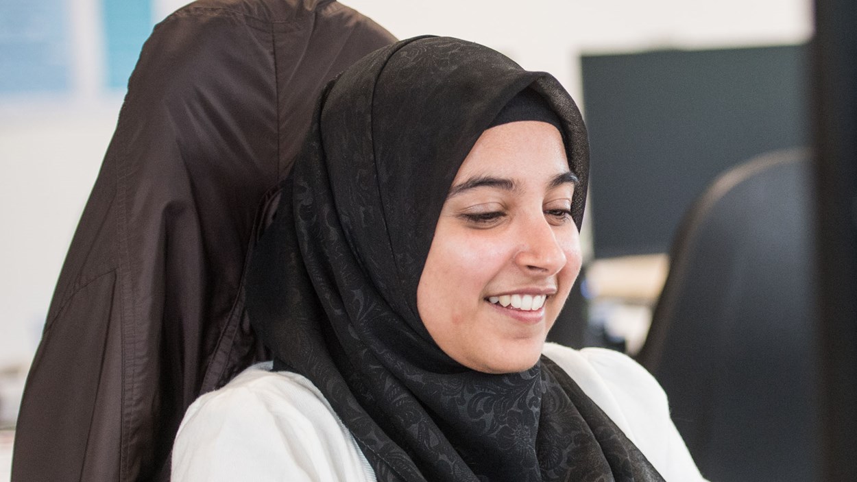 A smiling woman in an office