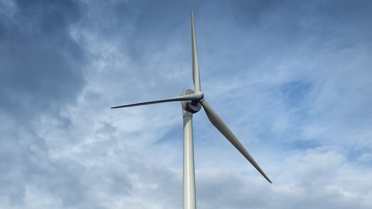 A wind turbine built by Skanska, producing green energy
