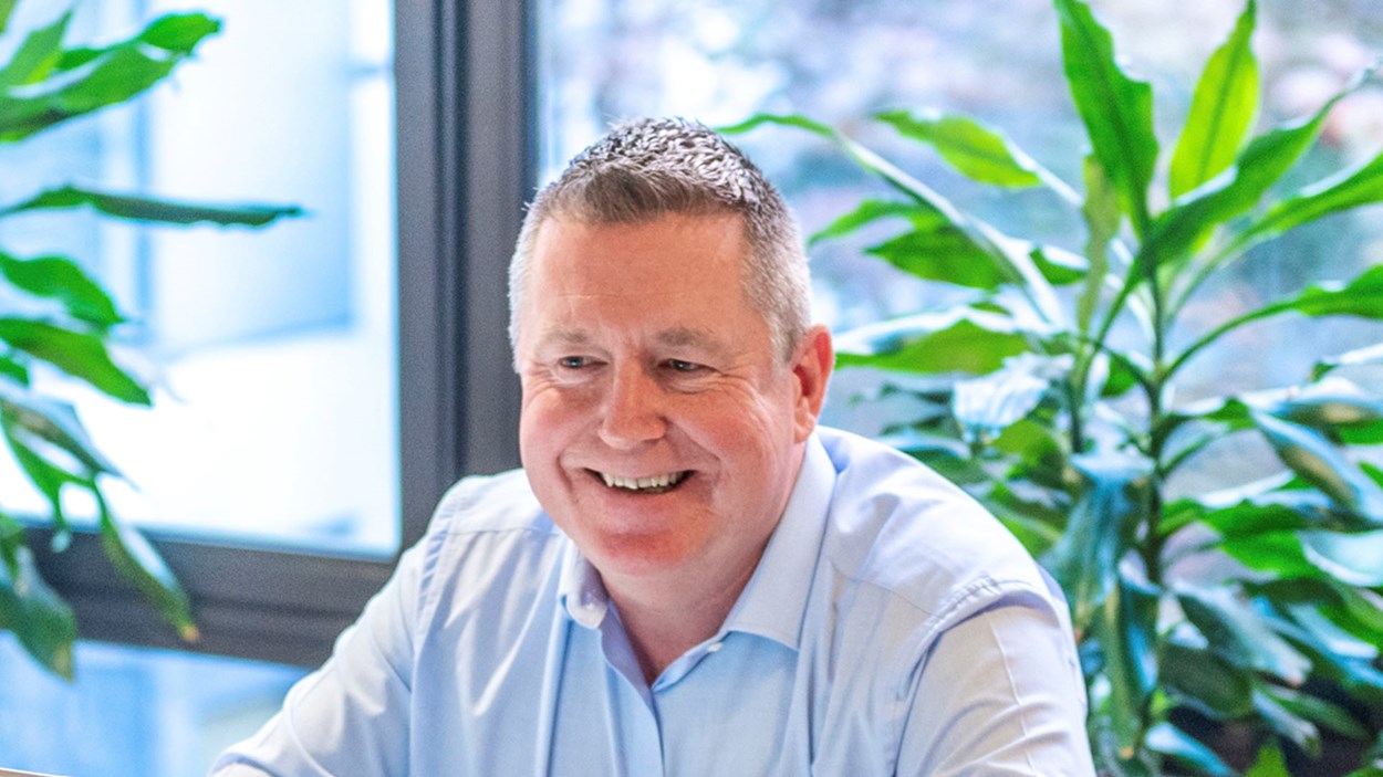 A smiling man in an office