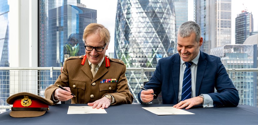 Steve Holbrook and Major General Simon Brooks-Ward sign the covenant Steve Holbrook and Major General Simon Brooks-Ward sign the covenant