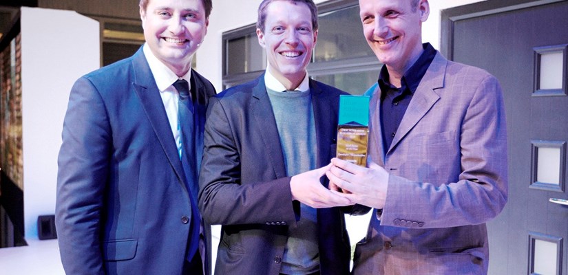 Andreas Nolin, Homes by Skanska (centre) collecting the award from channel 4 presenter George Clarke (left) with Michael Richter, Formation Architects. Andreas Nolin, Homes by Skanska (centre) collecting the award from channel 4 presenter George Clarke (left) with Michael Richter, Formation Architects.