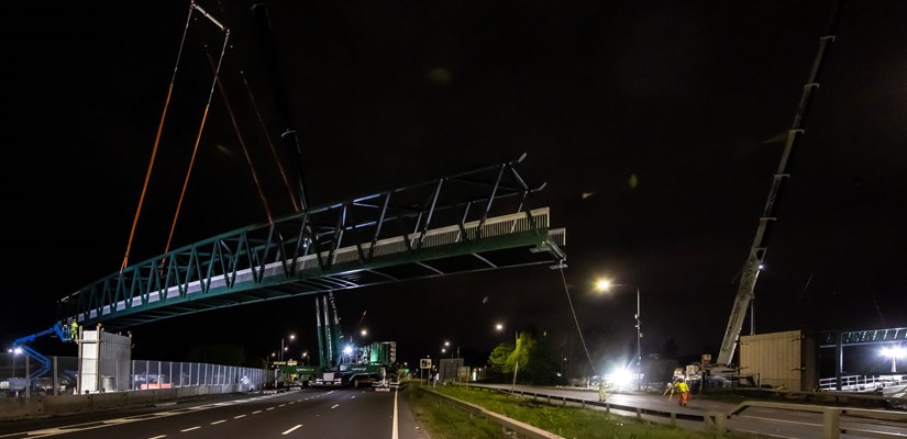 Footbridge being lowered into position over the A45