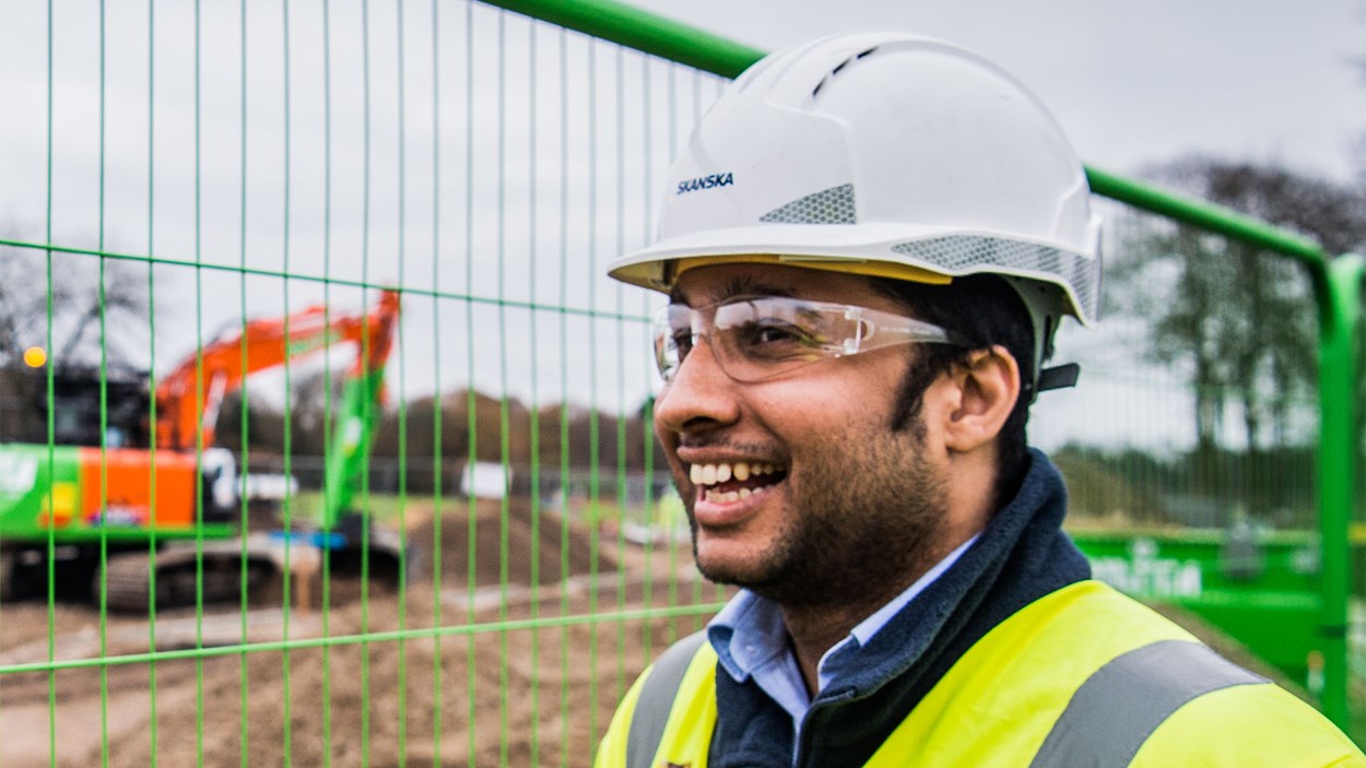 A smiling Skanska employee on site at the Worthy Down military construction project