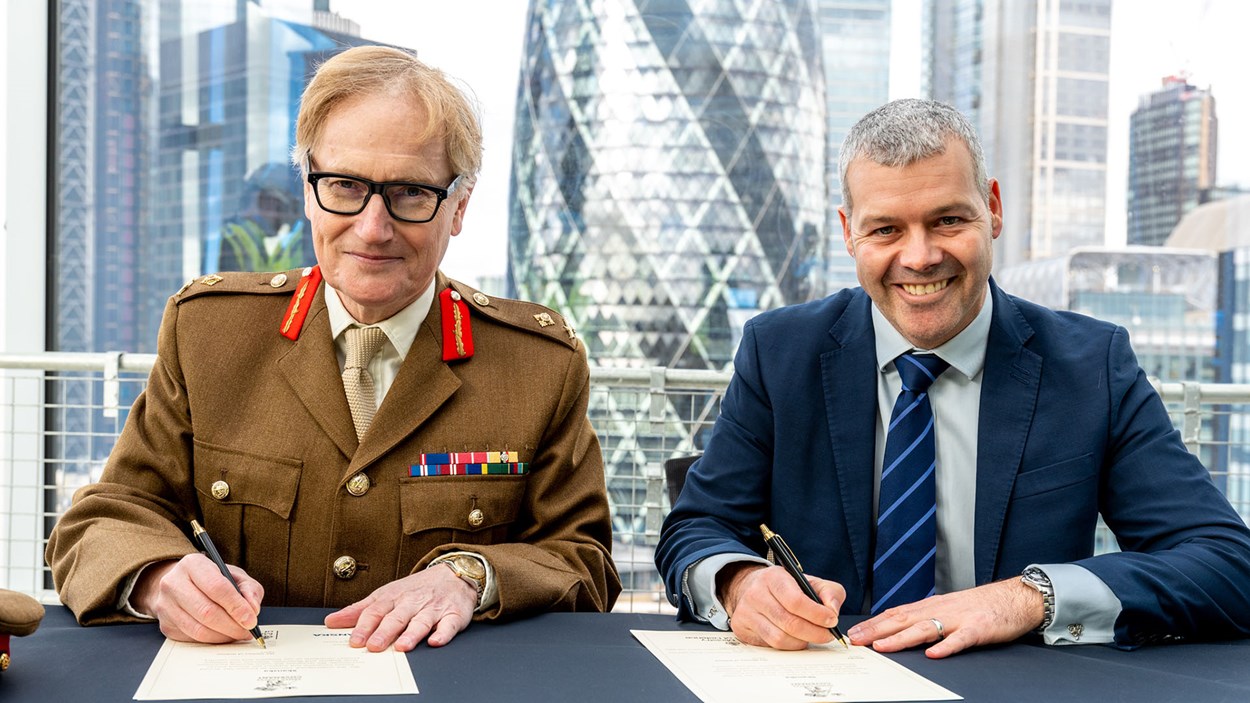 Major General Simon Brooks-Ward and Manging Director Steve Holbrook from Skanska sign the military covenant