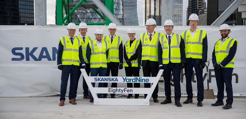 The customer celebrated the construction milestone with the team The customer celebrated the construction milestone with the team