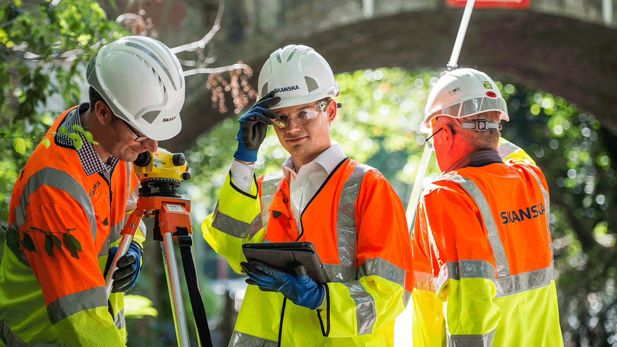 Skanska engineers taking precise laser measurements