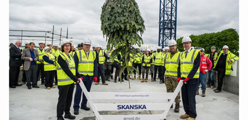 Key stakeholders from the MOD and DIO celebrate the Worthy Down College Building topping out with Skanska MD Terry Elphick