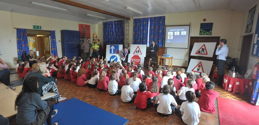 The children receive their high visibility reflectors The children receive their high visibility reflectors