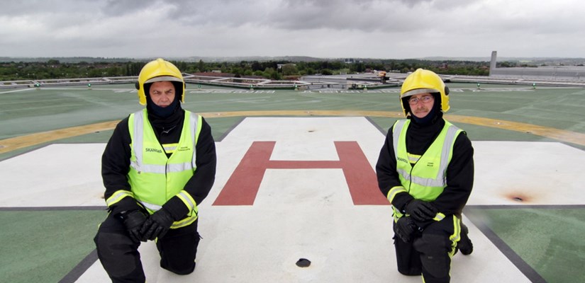 Martin Tunnicliffe and John Mead on the rooftop helipad above the hospital